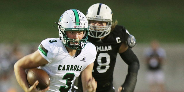 Under Pressure, Southlake Carroll's quarterback, Sophomore Quinn Ewers (3) runs the ball for a first down in the first quarter in their game against the Permian Panthers Friday night in Odessa Texas on Sept. 13, 2019.