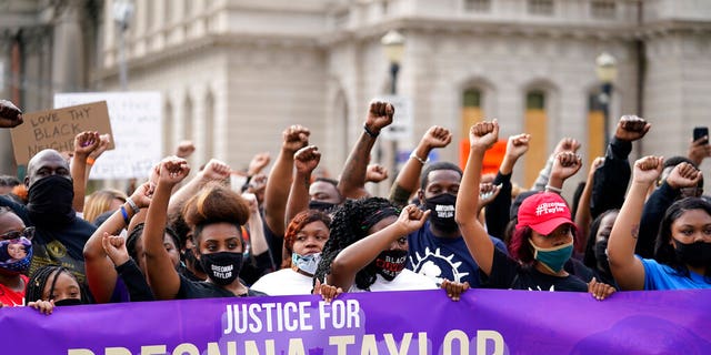 Black Lives Matter protesters march, Friday, Sept. 25, 2020, in Louisville. (AP Photo/Darron Cummings)