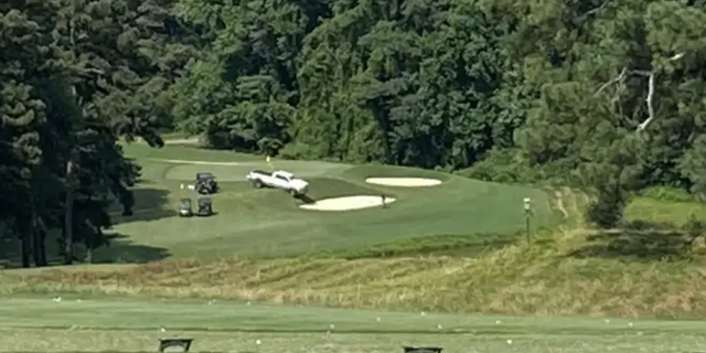 A suspect driving this white pickup truck shot golf pro Gene Siller on July 3. 