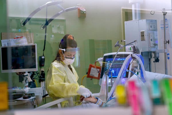 An I.C.U. nurse treats a Covid-19 patient at Oregon Health and Science University in Portland last week.