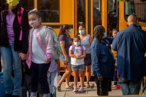 Students arrive at Normont Elementary in Los Angeles for the first day of school on Aug. 16.