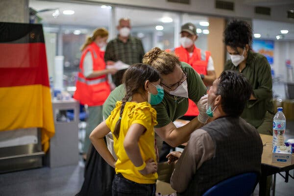 Evacuees from Kabul being tested for the coronavirus upon their arrival at Tashkent Airport in Uzbekistan on Tuesday.