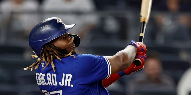 Toronto Blue Jays' Vladimir Guerrero Jr. hits a home run against the New York Yankees during the ninth inning of a baseball game Thursday, Sept. 9, 2021, in New York. The Blue Jays won 6-4. 