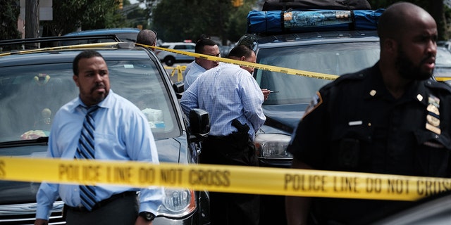 Police converge on the scene of a shooting in Brooklyn, one of numerous during the day, on July 14, 2021 in New York City.  (Photo by Spencer Platt/Getty Images)