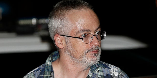 Wyndham Lathem, a former Northwestern University professor, is set to stand trial in the stabbing death of his boyfriend as part of what prosecutors said was a sexual fantasy he shared with another man who was charged in the case. Jury selection, opening statements and testimony from at least one witness were expected to happen Monday. (AP Photo/Jim Young, Pool, File)