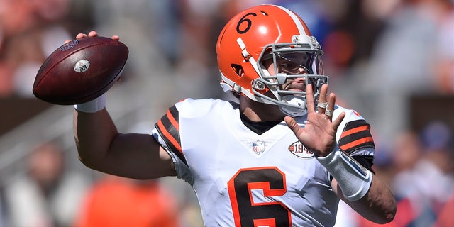 Cleveland Browns quarterback Baker Mayfield throws during the first half of an NFL football game against the Chicago Bears, Sunday, Sept. 26, 2021, in Cleveland.