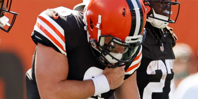 Cleveland Browns quarterback Baker Mayfield holds his shoulder after getting hurt during the first half of an NFL football game against the Houston Texans, Sunday, Sept. 19, 2021, in Cleveland.