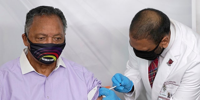The Rev. Jesse Jackson receives the Pfizer-BioNTech COVID-19 vaccine from Dr. Kiran Chekka, Covid administration physician, at the Roseland Community Hospital in Chicago. (Associated Press)