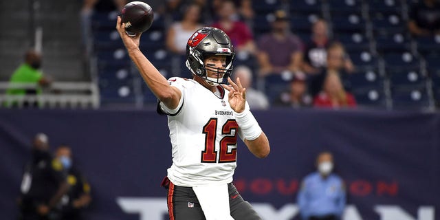Tampa Bay Buccaneers quarterback Tom Brady throws a pass against the Houston Texans during the first half of an NFL preseason football game Saturday, Aug. 28, 2021, in Houston.