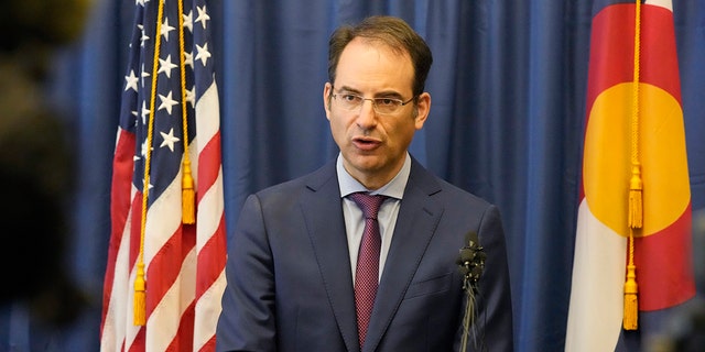 In this Sept. 1, 2021, file photo, Colorado Attorney General Phil Weiser talks about a grand jury investigation into the death of Elijah McClain, a Black man who was put in a chokehold by police and injected with a powerful sedative two years ago, during a news conference in Denver.