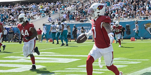 Arizona Cardinals cornerback Byron Murphy (7) celebrates his touchdown against the Jacksonville Jaguars on an intercepted pass during the second half of an NFL football game, Sunday, Sept. 26, 2021, in Jacksonville, Florida.