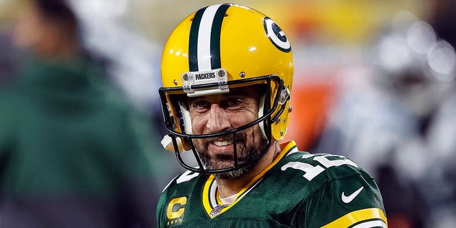 Green Bay Packers quarterback Aaron Rodgers (12) smiles before an NFL football game against the Carolina Panthers in Green Bay, Wisconsin.
