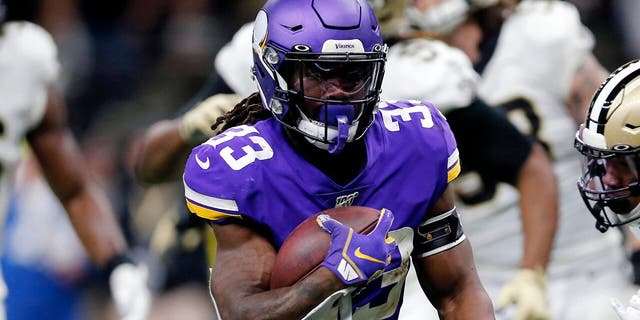 Minnesota Vikings running back Dalvin Cook (33) carries for a touchdown in front of New Orleans Saints free safety Marcus Williams (43) in the first half of an NFL wild-card playoff football game, Sunday, Jan. 5, 2020, in New Orleans. (AP Photo/Brett Duke)