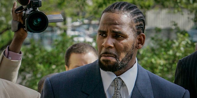 This photo from Friday May 9, 2008, shows R. Kelly arriving for the first day of jury selection in his child pornography trial at the Cook County Criminal Courthouse in Chicago. On Wednesday, Sept. 15, 2021, prosecutors in Kelly's sex trafficking trial at Brooklyn Federal Court in New York, played video and audio recordings for the jury they say back up allegations he abused women and girls.
