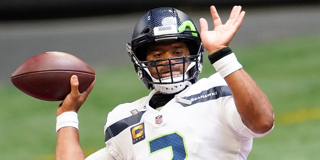 Seattle Seahawks quarterback Russell Wilson (3) warms up before the first half of an NFL football game against the Atlanta Falcons, Sunday, Sept. 13, 2020, in Atlanta. (AP Photo/John Bazemore)