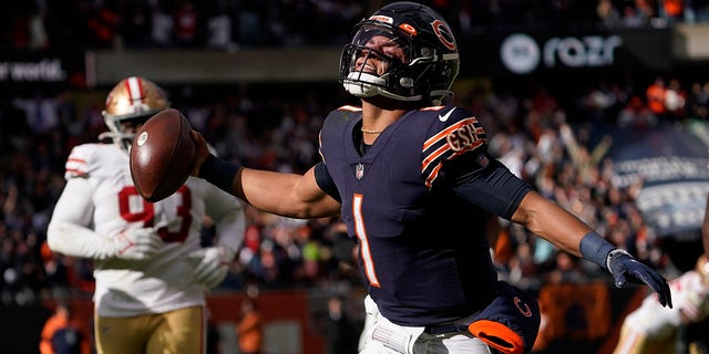 Chicago Bears quarterback Justin Fields begins to celebrate his touchdown against the San Francisco 49ers during the second half Sunday, Oct. 31, 2021, in Chicago.