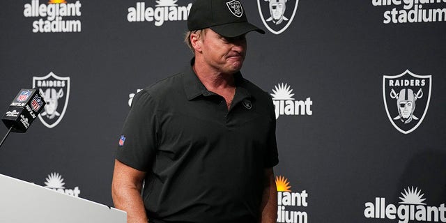 Las Vegas Raiders head coach Jon Gruden leaves after speaking during a news conference after an NFL football game against the Chicago Bears in Las Vegas, in this Sunday, Oct. 10, 2021, file photo. Jon Gruden is out as coach of the Las Vegas Raiders after emails he sent before being hired in 2018 contained racist, homophobic and misogynistic comments.