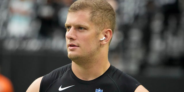 Las Vegas Raiders defensive end Carl Nassib (94) wears airpods before the game against the Miami Dolphins at Allegiant Stadium.