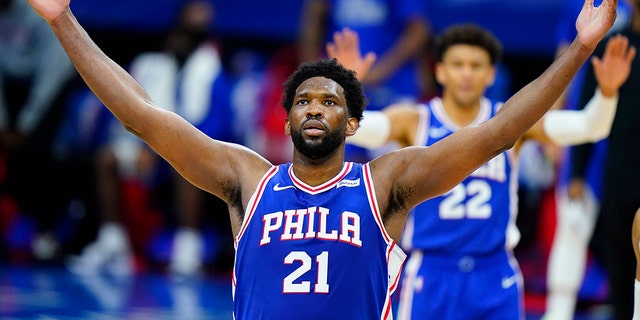 In this Feb. 19, 2021, file photo, Philadelphia 76ers' Joel Embiid reacts after making a basket during the second half of an NBA basketball game against the Chicago Bulls in Philadelphia.