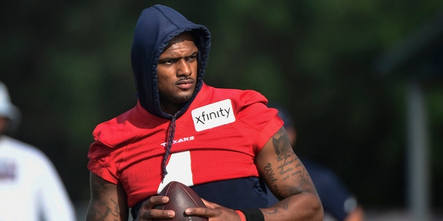 FILE: In an Aug. 2, 2021 file photo, Texans quarterback Deshaun Watson practices with the team in Houston. Attorneys involved in the lawsuits accusing Watson of sexual assault and harassment say the FBI has become involved in the case. Tony Buzbee, the attorney for the 22 women who have sued Watson, said Wednesday, Aug. 18, 2021, he and some of his clients have spoken with FBI agents about the allegations against Watson.