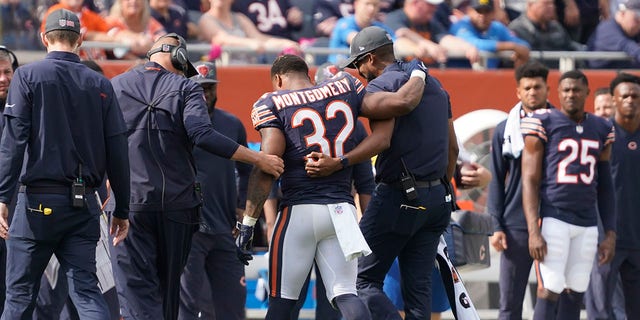 Chicago Bears running back David Montgomery is assisted off the field during the second half of an NFL football game against the Detroit Lions Sunday, Oct. 3, 2021, in Chicago. The Bears won 24-14. 