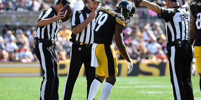Pittsburgh Steelers wide receiver JuJu Smith-Schuster (19) gets up after being injured on a play during the first half of an NFL football game against the Denver Broncos in Pittsburgh, Sunday, Oct. 10, 2021.