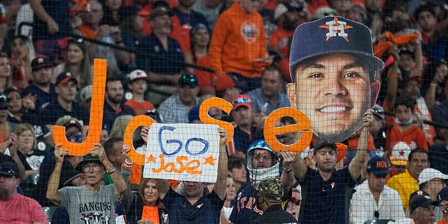 Spectators cheer for Houston Astros second baseman Jose Altuve during the first inning in Game 1 of a baseball American League Division Series between the Houston Astros and the Chicago White Sox Thursday, Oct. 7, 2021, in Houston.