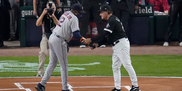 Houston Astros manager Dusty Baker Jr., left, and Chicago White Sox manager Tony La Russa greet each other before Game 3 of a baseball American League Division Series, Sunday, Oct. 10, 2021, in Chicago.