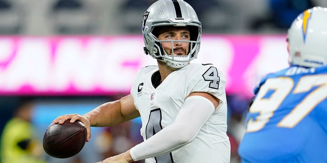Las Vegas Raiders quarterback Derek Carr throws a pass during the first half of an NFL football game against the Los Angeles Chargers, Monday, Oct. 4, 2021, in Inglewood, Calif.