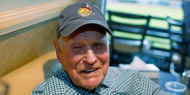 FILE - In this Tuesday, Nov. 1, 2016 file photo, Eddie Robinson sits in a box at Progressive Field before Game 6 of the Major League Baseball World Series against the Chicago Cubs in Cleveland. Former big leaguer and general manager Eddie Robinson, who was the oldest living former MLB player, has died at age 100. The Texas Rangers, the team for which Robinson was GM from 1976-82, said he passed away Monday night, Oct. 4, 2021 at his ranch in Bastrop, Texas.