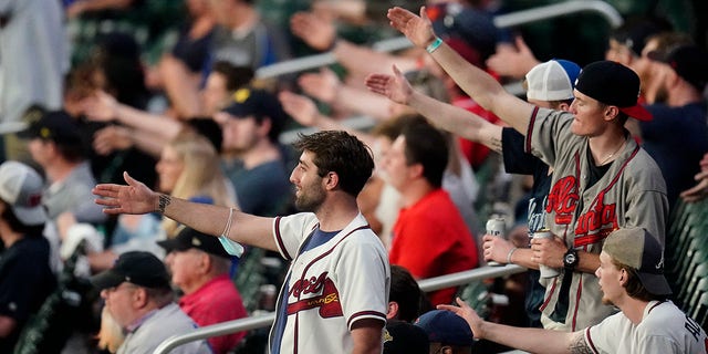 ATLANTA, GA - APRIL 27: The fans do The Chop during the Tuesday night MLB game between the Atlanta Braves and the Chicago Cubs on April 27, 2021 at Truist Park in Atlanta, Georgia. 