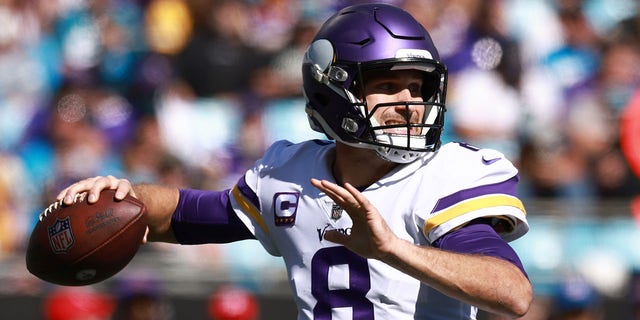 CHARLOTTE, NORTH CAROLINA - OCTOBER 17: Kirk Cousins #8 of the Minnesota Vikings throws the ball during the second quarter against the Carolina Panthers at Bank of America Stadium on October 17, 2021 in Charlotte, North Carolina.