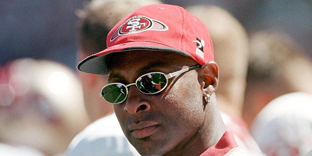 San Francisco 49ers Jerry Rice watches the exhibition game against the New England Patriots 02 August in San Francisco, CA. Rice will sit out for the remainder of the pre-season while healing his knee that he re-injured last season.