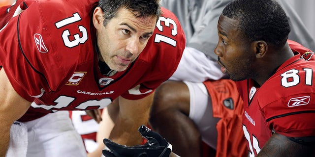 Arizona Cardinals quarterback Kurt Warner (left) talks to his wide receiver Anquan Boldin in the fourth quarter against the Indianapolis Colts during an NFL game in Glendale, Arizona, Sept. 27, 2009. The Colts defeated the Cardinals.