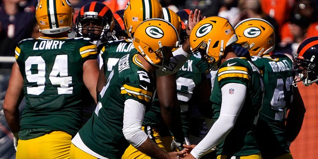 Green Bay Packers kicker Mason Crosby, left, celebrate his field goal with holder Corey Bojorquez during the first half of an NFL football game against the Chicago Bears Sunday, Oct. 17, 2021, in Chicago.