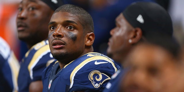 Michael Sam #96 of the St. Louis Rams watches from the bench during the second half of a pre-season against the New Orleans Saints game at the Edward Jones Dome on August 8, 2013 in St. Louis, Missouri. The Saints beat the Rams 26-24. 
