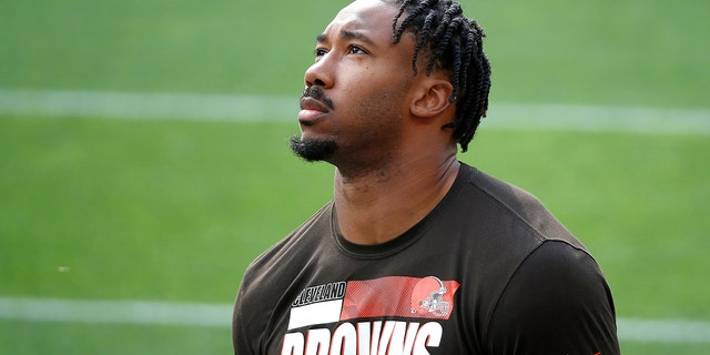 Cleveland Browns defensive end Myles Garrett (95) walks on the field prior to the start of an NFL football game against the Indianapolis Colts, Sunday, Oct. 11, 2020, in Cleveland. Garrett was playing as well as any defender in the league when he fell ill and went on the COVID list after a positive test on Nov. 20. He missed Cleveland's past two games _ wins over Philadelphia and Jacksonville _ while isolating and recovering at home.(AP Photo/Kirk Irwin)