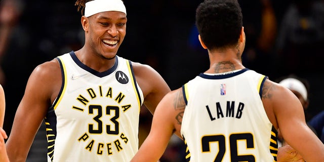Indiana Pacers center Myles Turner (33) celebrates with guard Jeremy Lamb (26) after making a shot late in the fourth quarter to take a lead against the Memphis Grizzlies  Oct 13, 2021, at Gainbridge Fieldhouse in Indianapolis, Indiana.