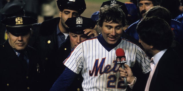Ray Knight #22 of the New York Mets being interviewed by Marv Albert after the Mets win Game 7 of the 1986 World Series against the Boston Red Sox in Shea Stadium on Oct. 27, 1986 in Flushing, New York.