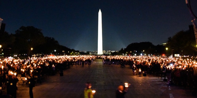 The Washington Monument is seen as thousands of candles light up the night sky at the National Mall in Washington D.C. Thursday evening. (FBI)