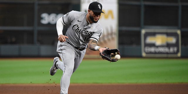 Chicago White Sox third baseman Yoán Moncada fields a ground ball by Houston Astros second baseman Jose Altuve during the third inning in Game 2 of an American League Division Series game Friday, Oct. 8, 2021, in Houston.  