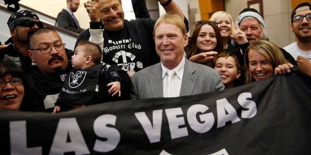 April 28, 2016:  Oakland Raiders owner Mark Davis, center, meets with Raiders fans after speaking at a meeting of the Southern Nevada Tourism Infrastructure Committee in Las Vegas.