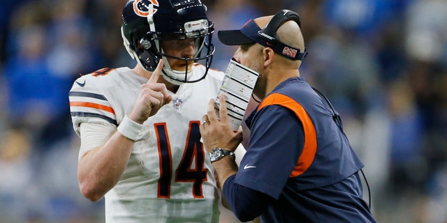 Chicago Bears quarterback Andy Dalton talks with head coach Matt Nagy during the second half of an NFL football game against the Detroit Lions, Thursday, Nov. 25, 2021, in Detroit. 