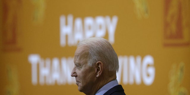 U.S. President Joe Biden listens to first lady Jill Biden speak during a Thanksgiving event with U.S. service members and military families at Fort Bragg, North Carolina, U.S., November 22, 2021. REUTERS/Leah Millis