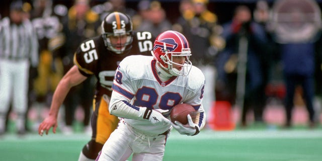 PITTSBURGH, PA - JANUARY 6: Punt returner Steve Tasker #89 of the Buffalo Bills is pursued by linebacker Jerry Olsavsky #55 of the Pittsburgh Steelers as he runs with the football during a playoff game at Three Rivers Stadium on January 6, 1996 in Pittsburgh, Pennsylvania. The Steelers defeated the Bills 40-21.
