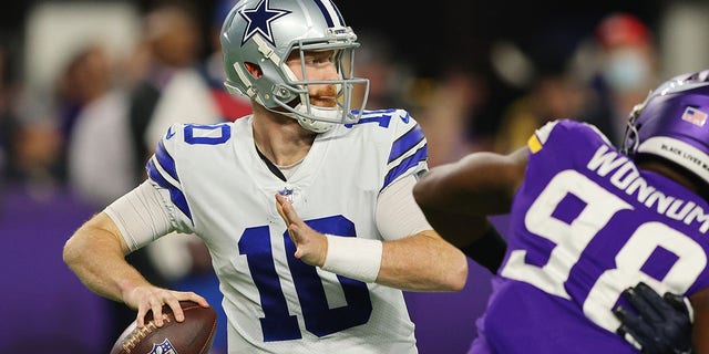 MINNEAPOLIS, MINNESOTA - OCTOBER 31: Cooper Rush #10 of the Dallas Cowboys throws a pass against the Minnesota Vikings at U.S. Bank Stadium on October 31, 2021 in Minneapolis, Minnesota. (Photo by Adam Bettcher/Getty Images)