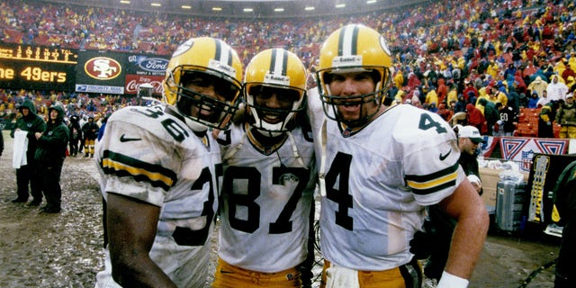 Green Bay Packers safety LeRoy Butler (36), wide receiver Robert Brooks (87), and quarterback Brett Favre (4) look jubilant late in the game during the NFC Championship Game, a 23-10 victory over the San Francisco 49ers on January 11, 1998, at 3Com Park in San Francisco, California.