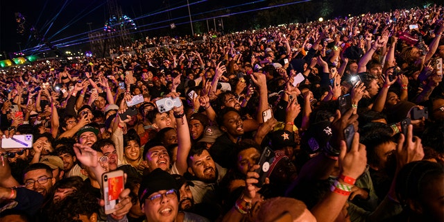 The crowd watches as Travis Scott performs at Astroworld Festival at NRG park on Friday, Nov.  5, 2021 in Houston. Several people died and numerous others were injured in what officials described as a surge of the crowd at the music festival while Scott was performing. Officials declared a "mass casualty incident" just after 9 p.m. Friday during the festival where an estimated 50,000 people were in attendance, Houston Fire Chief Samuel Peña told reporters at a news conference. (Jamaal )