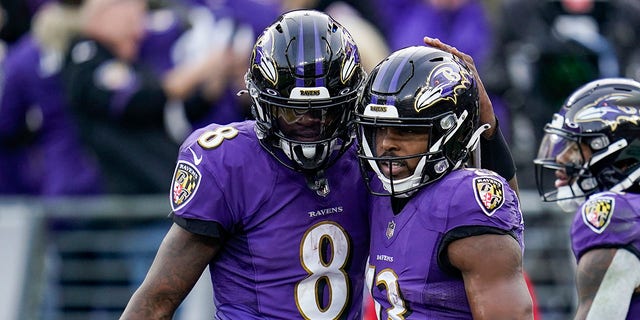 Ravens quarterback Lamar Jackson (8) and wide receiver Devin Duvernay celebrate a touchdown against the Minnesota Vikings, on Nov. 7, 2021, in Baltimore.