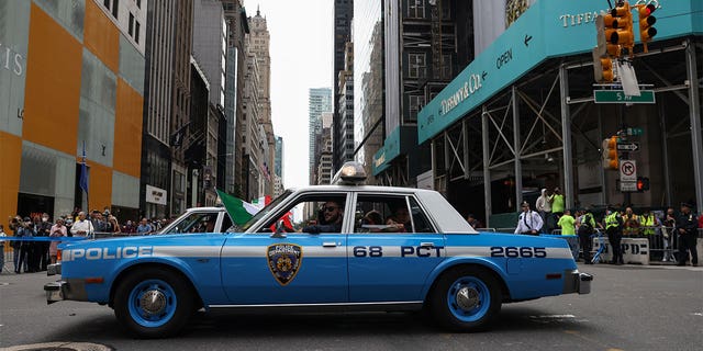 A New York Police Department vehicle makes its way along Fifth Avenue during the Columbus Day Parade in New York City, U.S., October 11, 2021. REUTERS/Shannon Stapleton
